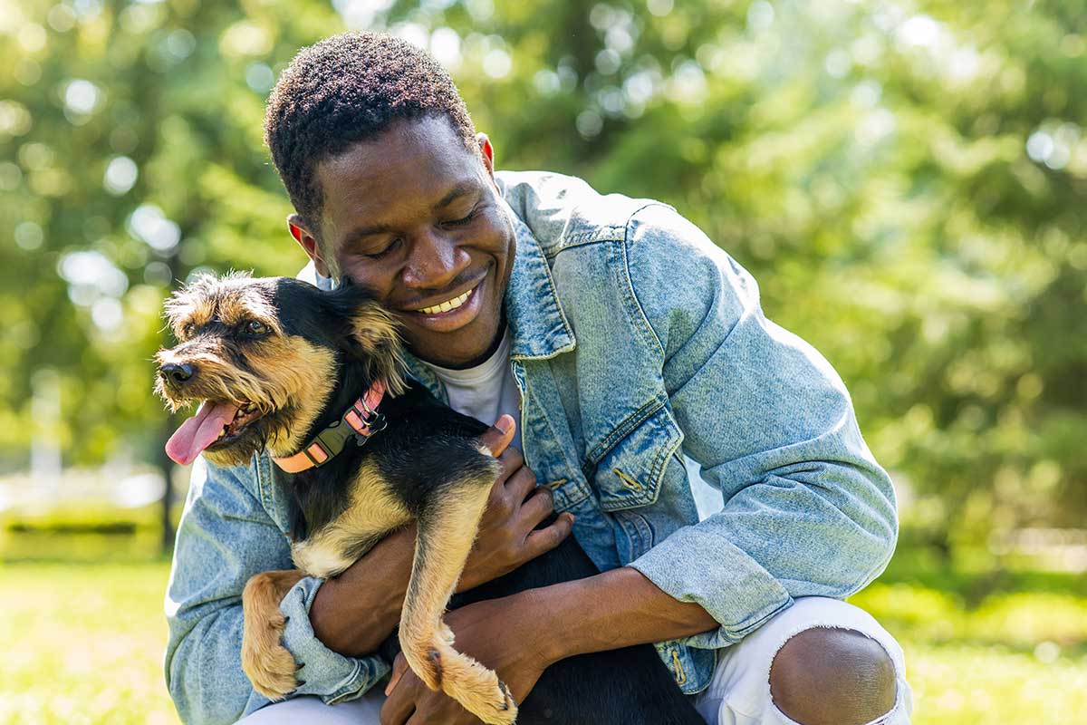 A man hugging his dog A man hugging his dog
